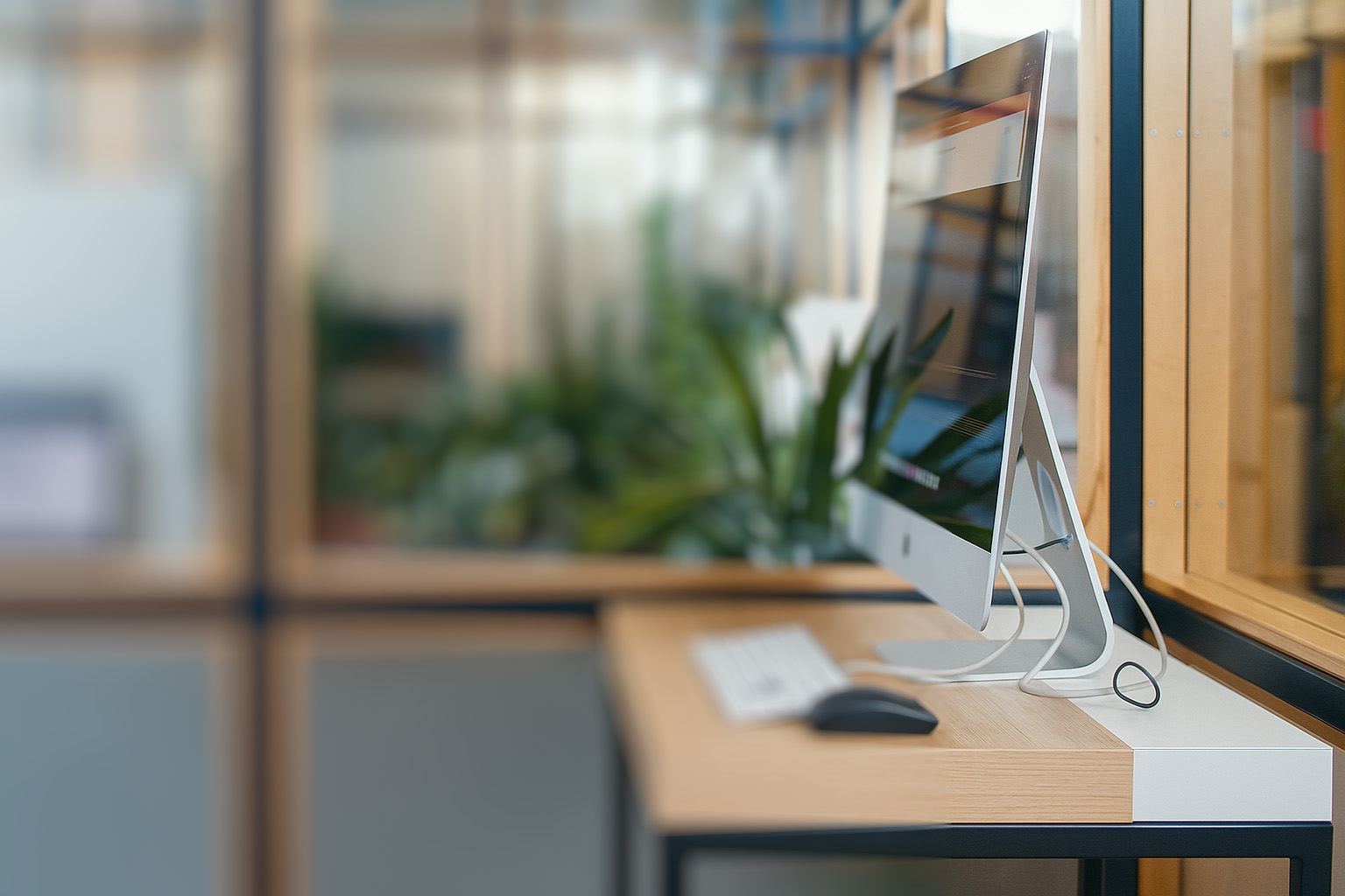 An imac on desk at bbg bitbase office
